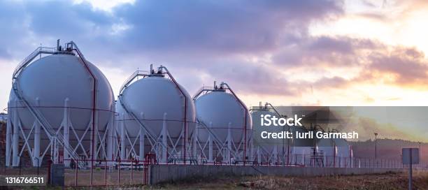 Gas Storage Tanks At Sunset Stock Photo - Download Image Now - Natural Gas, Gas, Motor Oil