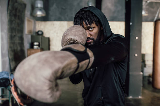 istock black boxer. Punch to the camera, close-up 1316767600