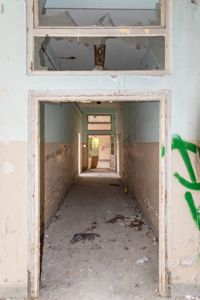 istock Inside view of a deserted run down building 1316767797