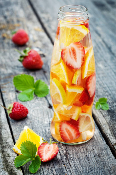 istock Fresh fruit detox water in bottle on wooden table 1316767977