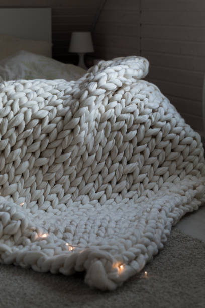 istock White scandinavian interior with knit plaid. 1316767988