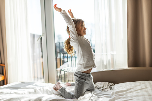 Portrait of a beautiful girl stretching in the morning.