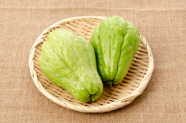 istock Fresh Chayote on bamboo sieve on burlap background 1316768777