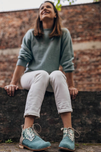 istock Modern woman sitting outdoors 1316769454