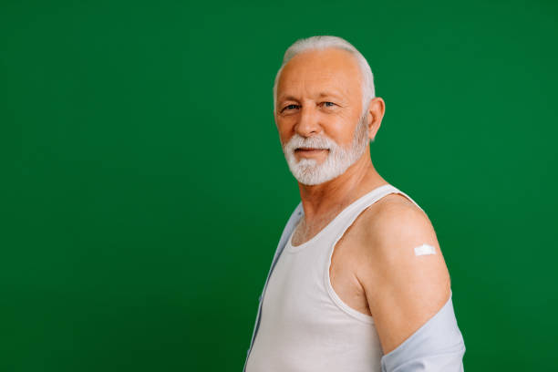 istock Elderly man, portrait, green background. 1316770680