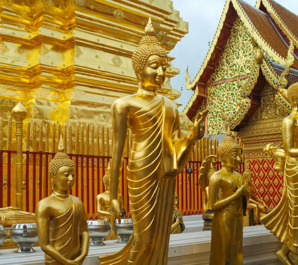 istock golden temples and thai praying statues 1316771698