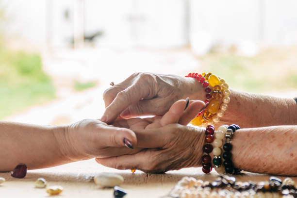 istock Grandma magic, fortune telling, palmistry. Chiromancy, women hands, destiny reading 1316771811