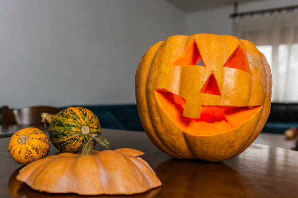 istock Carved pumpkins placed on the table 1316772699
