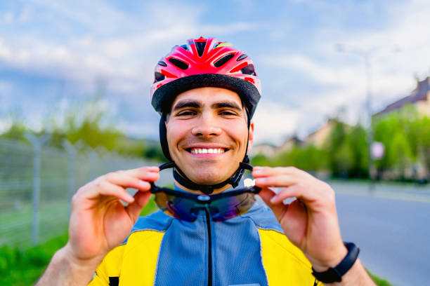 istock Cyclist putting on sunglasses 1316773871