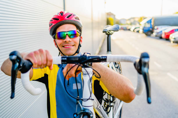 istock Male cyclist lifting his bike 1316774399