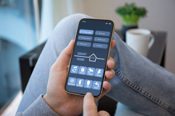 istock male hands hold phone with smart home application on screen 1316774504