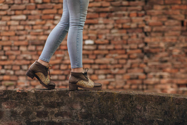 istock Woman wearing modern shoes 1316775237