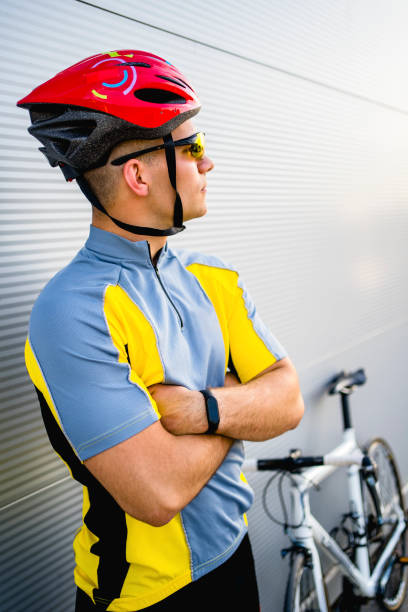 istock Young cyclist standing next to bicycle 1316775830