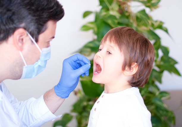 istock Little Boy Visiting Pediatrician 1316776981