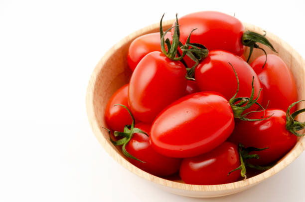 istock Fresh cherry tomatoes aiko in Wooden bowl on white background 1316777065
