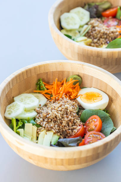istock Brown rice salad with carrot, egg, cucumber, avocado, tomato and lamb's lettuce 1316779214