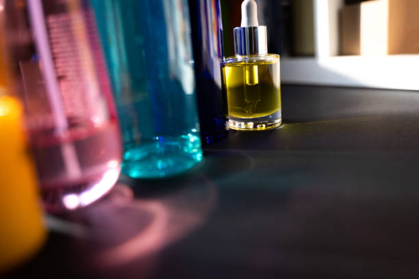 istock Multicolor glass bottles and reflections in harsh light 1316788396