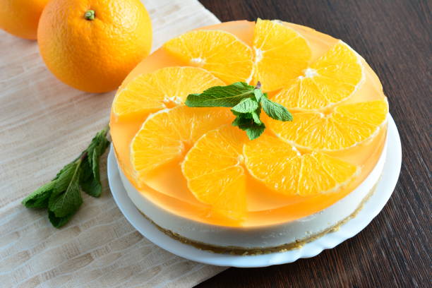 istock orange cheesecake with mint leaves on the brown tablecloth 1316788418