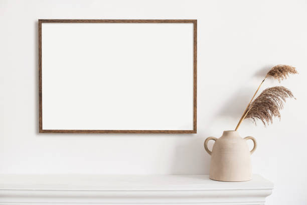 istock Artwork mock-up in interior design. Blank picture frame template on white wall 1316789046