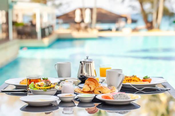 istock American Breakfast Set on Table Next to Poolside in Resort 1316789984