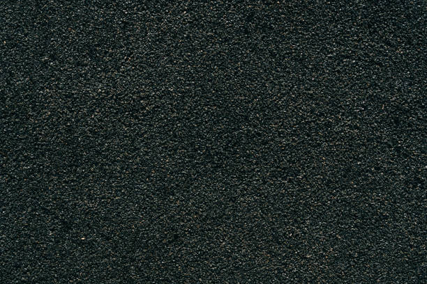 Surface texture of black rubber crumb on the playground