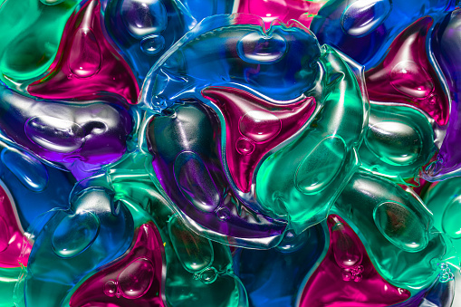 Pile of laundry detergent pods background