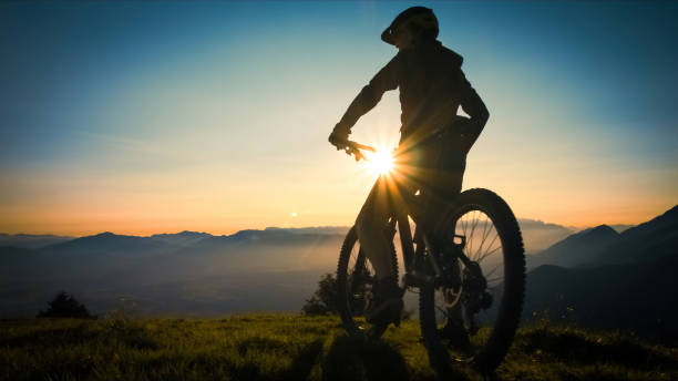 istock Cyclist silhouette watching the sunset 1316795137