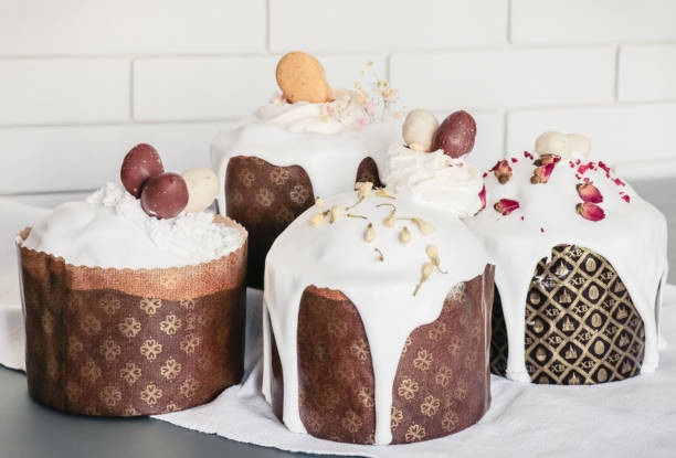 istock Homemade Easter cakes decorated with white sugar icing with drips, dried flowers and chocolate eggs 1316796357
