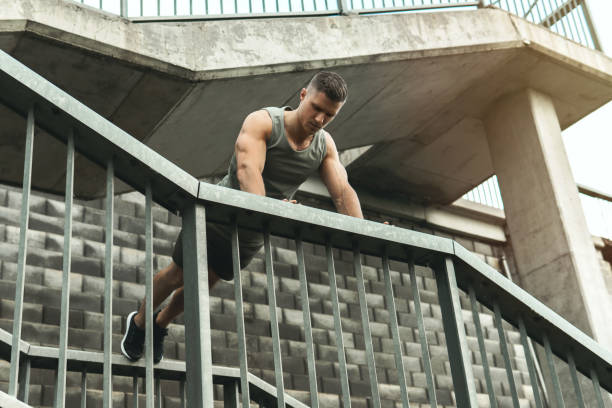 istock Muscular man is doing push-ups during calisthenic workout on a street 1316796443