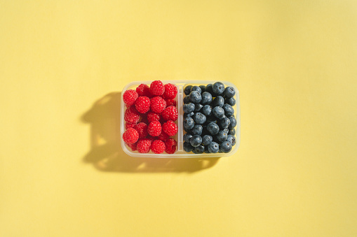 Fresh berries in a reusable plastic container