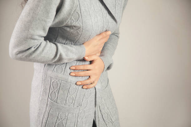 istock woman hand in ache stomache 1316798292