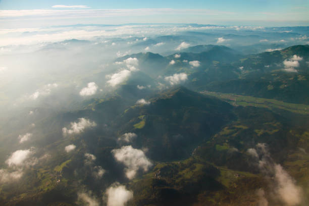 Julian alps with Triglav - Slovenia tallest mountain arial view. Fog and clouds.