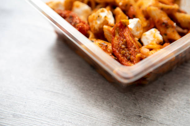 istock Feta, tomato and pasta salad, in a square plastic (polyethylene terephthalate) tub, with copy space 1316800481