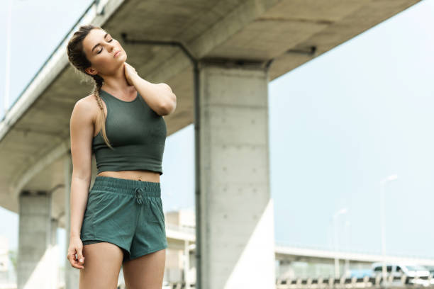 istock Confident woman athlete is warming up before her street workout 1316801143