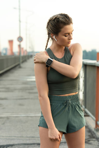 istock Confident woman athlete is warming up before her street workout 1316801162