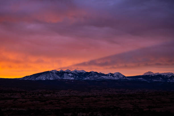istock La Sal Mountains Cast Shadow In The Sky At Sunrise 1316802671