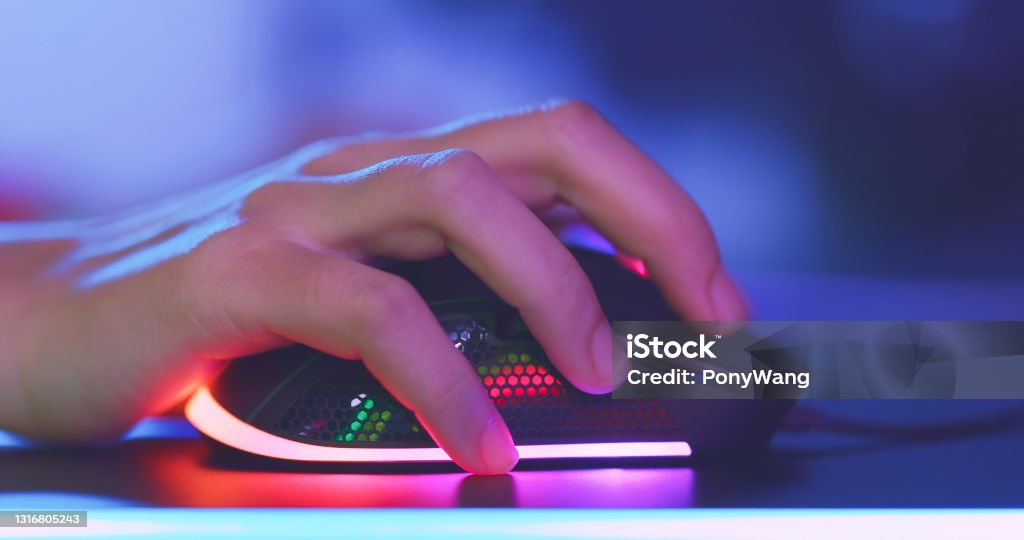 Esport rgb mouse click close up of pro cyber sport gamer play game with RGB mouse Computer Mouse Stock Photo