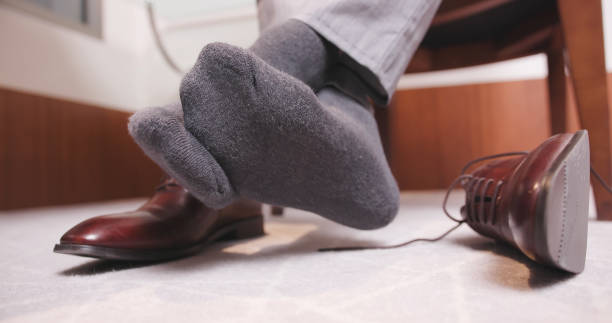 istock man with athlete foot 1316805438