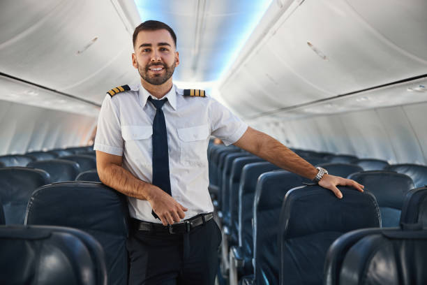 istock Friendly professional airman posing in the airplane 1316805709