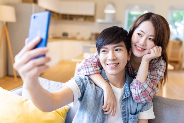 istock asian couple take selfie 1316805815