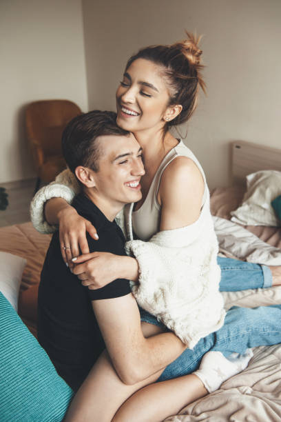 istock Lovely man embracing his lover while playing in bed in the morning 1316806646