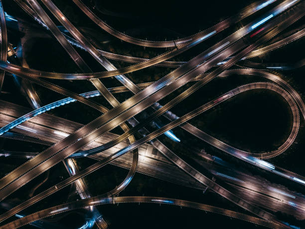 istock Aerial View of Complex Overpass and Busy Traffic at Night 1316806803
