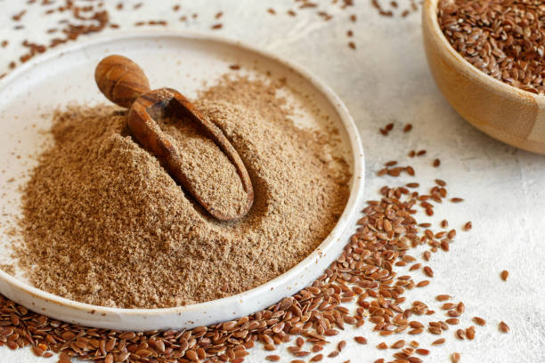istock Raw Flax seeds flour in a plate with a spoon 1316806917