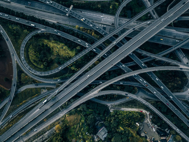istock Aerial View of Complex Overpass and Busy Traffic 1316807118