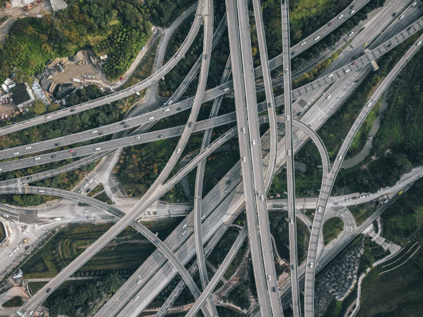 istock Aerial View of Complex Overpass and Busy Traffic 1316807321