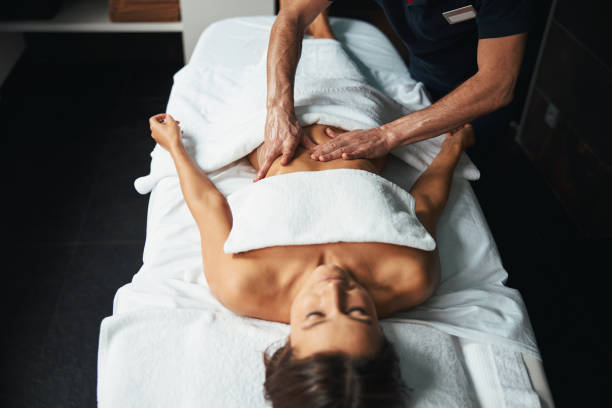 istock Unrecognized experienced massage therapist making manual therapy in wellness center 1316811257