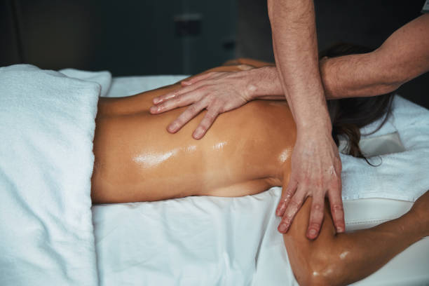 istock Unrecognized young brunette female lying on massage bed while receiving aroma therapy essential oil in medical center 1316811428