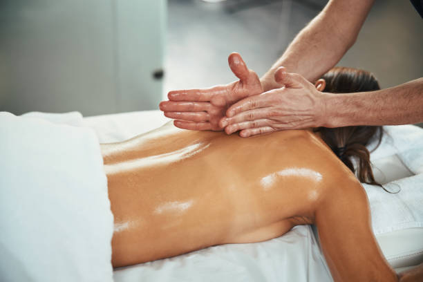 istock Beautiful young pretty lady lying on massage table while receiving aroma therapy in wellness center 1316811436