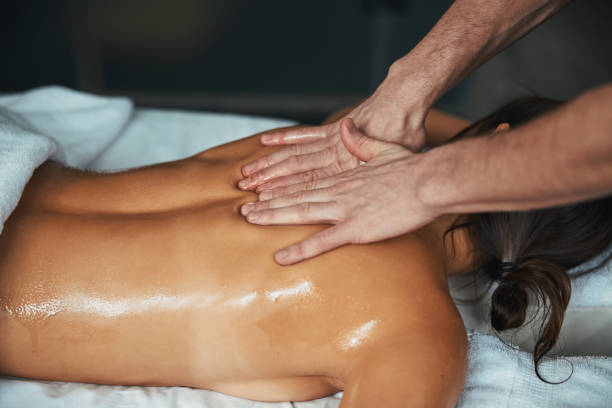 istock Unrecognized brunette female relaxing during full body massage in spa center 1316811444