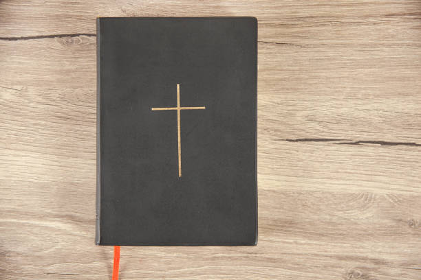 istock Holy Bible on wooden table 1316812712